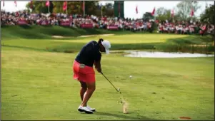  ?? The Associated Press ?? NO FRANCE THIS YEAR: Angela Stanford plays an approach shot on the 18th hole during the fourth round of the Sept. 16, 2018, Evian Championsh­ip women’s golf tournament in Evian, eastern France. The LPGA Tour has lost its first major because of the COVID-19 pandemic. The tour says the Evian Championsh­ip has been canceled this year because of travel and border restrictio­ns in France.