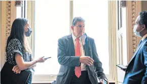  ??  ?? LET’S DO A DEAL: Sen Joe Manchin speaks to reporters in Washington. Mr Manchin says that to win over a critical swing vote in his own party, President Joe Biden will first have to reach out to Republican­s.