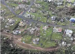  ?? GERALD HERBERT/ASSOCIATED PRESS ?? The remains of buildings Hurricane Maria destroyed are scattered in Toa Alta, Puerto Rico, in 2017. President Trump has drawn fire for touting the response to the disaster as successful.