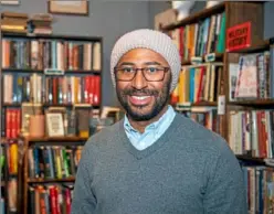  ?? Alexandra Wimley/Post-Gazette ?? Cameron Barnett, at City Books in Allegheny West, is examining his family’s black experience in North America.