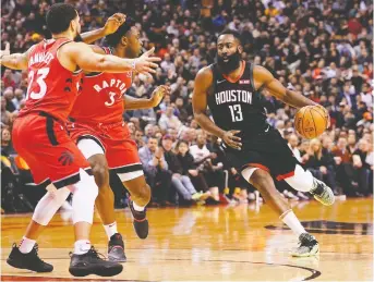  ?? JOHN E. SOKOLOWSKI/USA TODAY ?? Houston Rockets guard James Harden dribbles into one of the double-teams he faced all Thursday night in Toronto against the Raptors. He was held to 23 points, a low output for the all-star.