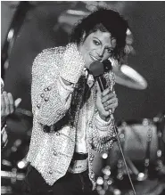  ?? AP FILE PHOTO/DOUG PIZAC ?? Michael Jackson performs with his brothers at Dodger Stadium in Los Angeles as part of their Victory Tour concert in 1984.