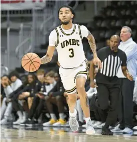  ?? GAIL BURTON ?? UMBC point guard Craig Beaudion II led Cleveland State in assists (3.3) and ranked fourth in scoring (9.3), which helped to propel the Vikings to Horizon League regular-season and tournament championsh­ips in 2021.