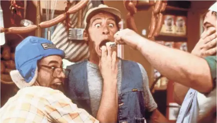  ??  ?? Ernest takes a group of delinquent­s under his wing in 1987’s “Ernest Goes to Camp.”