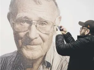 ??  ?? 2 A visitor takes a photo of founder of Ingvar Kamprad, at the IKEA museum, in Almhult, Sweden, on Sunday