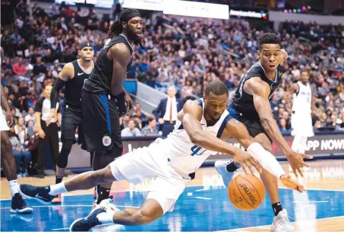 ?? PICTURE: USA TODAY Sports ?? Dallas Mavericks forward Harrison Barnes (No 40) and LA Clippers guard Shai Gilgeous-Alexander fight for the loose ball during the second quarter at the American Airlines Center.