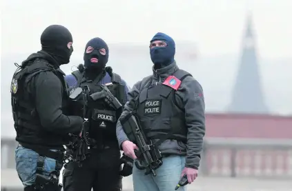  ?? Christian Hartmann / Reuters ?? Police secure the area around the Palais de Justice courthouse in Brussels after this week’s terrorist attacks in the city. Belgium struggles more than any other European Union country with home-grown terrorists.