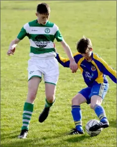  ??  ?? Eoin Gahan (St. Joseph’s) taking on Darragh Farrell (Shamrock Rovers) in the Under-15 Cup final in Castlebrid­ge on Saturday.