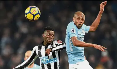  ?? — AFP ?? On the watch list: Manchester City’s Fernandinh­o (right) vying for the ball with Newcastle’s Christian Atsu in the Premier League match at the Etihad on Jan 20.