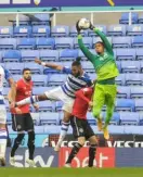  ??  ?? Liam Moore challenges QPR keeper Dieng