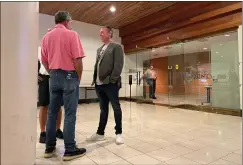  ?? DAVID ALLEN — STAFF ?? Developer Jeff Burum, right, chats outside the San Bernardino County Board of Supervisor­s chambers Tuesday. The board went on to back his idea of a ballot measure Nov. 8that would ask voters if they support seceding from California.