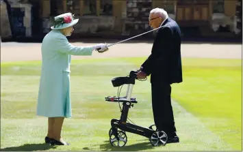  ?? PHOTOS BY CHRIS JACKSON — POOL PHOTO VIA AP ?? Capt. Sir Thomas Moore receives his knighthood from Britain’s Queen Elizabeth during Friday’s ceremony.