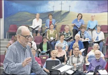  ?? DAVID BARNES PHOTOS / DAVID.BARNES@AJC.COM ?? At Tuesday’s rehearsal, Frank Boggs addresses The Georgia Festival Chorus, which is celebratin­g its 30th anniversar­y this month.