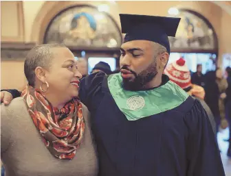  ?? CHICAGO TRIBUNE PHOTO ?? DIPLOMA DAY: Paris King, 23, who is on the autism spectrum, celebrates his graduation from Illinois’ Roosevelt University with his mother, Patricia King.