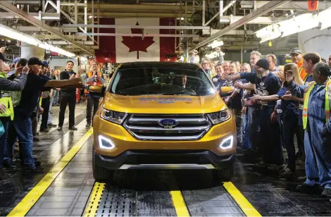  ?? CHRIS YOUNG/THE CANADIAN PRESS FILES ?? A new report says U.S. auto tariffs would likely result in outcomes that “are all profoundly negative for consumers, ... and for overall U.S. economic output and employment levels.” Canada is expected to face higher costs, too, despite tariff exemptions.
