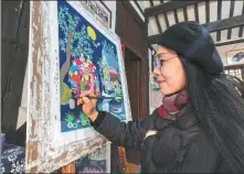  ?? From left: Jinshan folk artist Chen Huifang works on her new illustrate­d book Golden Childhood. Some of Chen’s illustrati­ons. PHOTOS PROVIDED TO CHINA DAILY. ??