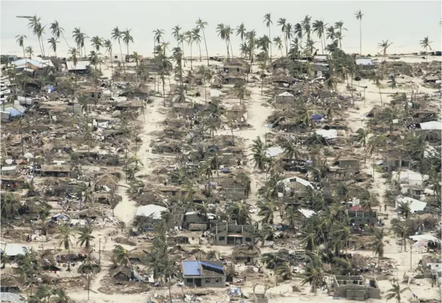  ?? PICTURE: SAVIANO ABREU/OCHA/AP ?? 0 Badly damaged communitie­s in Macomia district, Mozambique, where authoritie­s have urged many residents to seek higher ground