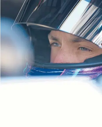  ?? JARED C. TILTON/GETTY ?? Denny Hamlin sits in his car during qualifying for the Toyota Owners 400 on Satuday.