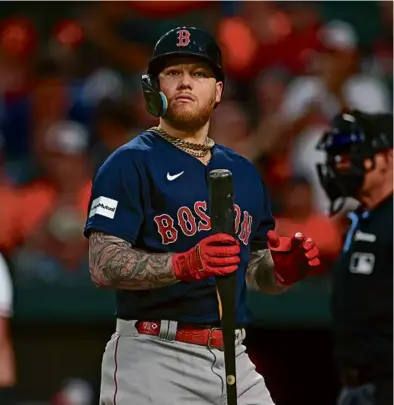  ?? ROB CARR/GETTY IMAGES ?? The Red Sox’ Alex Verdugo walks away after striking out to end the top of the first.