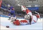  ?? Bruce Bennett / AP ?? Jocelyne Lamoureux-Davidson scores the game-winning goal against goalie Shannon Szabados.