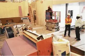  ?? Eddy Matchette / For the Chronicle ?? The Simon Youth Foundation Academy is building a school at the Katy Mills Mall for high school dropouts. At the right, Austin Shaw, project manager, left, and Tim Clark, Simon Youth Foundation vice president, talk about the school’s constructi­on...