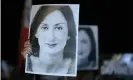  ??  ?? Protesters hold pictures of Daphne Caruana Galizia as they gather outside the prime ministers’s office in Valletta, Malta, the day Yorgen Fenech was detained on his yacht. Photograph: Matthew Mirabelli/AFP via Getty Images