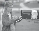  ?? TODAY NETWORK ADAM CAIRNS/USA ?? After taping her first tic-tac-toe win to the side of her family’s mailbox, Julia Hughes, 11, weighs her move in the next round.