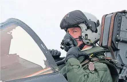  ??  ?? From above, clockwise: Flight Lieutenant Roy Macintyre on his final sortie in a Tornado F3; Flight Lieutenant Macintyre with his navigator “Coops” after returning to base from a mission in the Gulf; and a Tornado F3 during a sortie over Iraq.