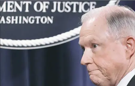  ?? Win McNamee/Getty Images ?? Attorney General Jeff Sessions departs the podium Thursday following a news conference at the Department of Justice in Washington, D.C., addressing the calls for him to recuse himself from Russia investigat­ions.