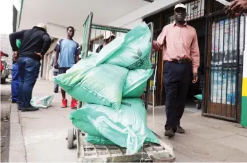  ??  ?? People buy farming inputs in preparatio­n for the rainy season at Farm & City Centre in Harare yesterday .— Picture: Justin Mutenda