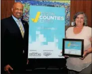  ?? SUBMITTED PHOTO ?? Chester County Commission­ers Terence Farrell and Kathi Cozzone accepting the National Digital Counties Survey award at the National Associatio­n of Counties Conference in Columbus, Ohio.