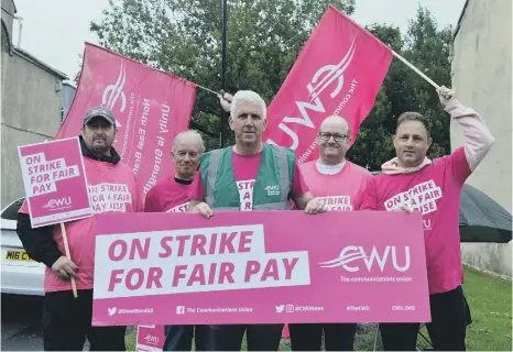  ?? ?? BT Customer Service Engineer Ian Hammond (front) is demanding a “fair” pay increase more in line with the rise in the cost of living.