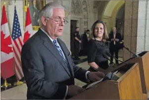  ?? CP PHOTO ?? Foreign Affairs Minister Chrystia Freeland looks on as U.S. Secretary of State Rex Tillerson responds to a question during a joint media availabili­ty on Parliament Hill in Ottawa, Tuesday.