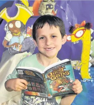  ?? CHRIS WHITEOAK
AN144133_04 ?? Oliver is one of the youngsters who has signed up for the annual summer reading challenge at Fleet Library.