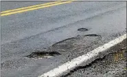  ?? FRAN MAYE - MEDIANEWS GROUP ?? One of many potholes on Route 842 in Pocopson Township.