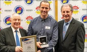  ??  ?? Barry Mahoney (centre) receiving his ‘Seiko Just in Time Rescue Award’ from Minister Michael Ring and Martin O’Sullivan, Chairman of Water Safety Ireland, at a presentati­on in UCD last week.