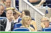  ?? MIKE EHRMANN/GETTY IMAGES ?? “We’re getting close, I think,” said potential Marlins buyer Jorge Mas, left. He has a seat just behind the plate — and team owner Jeffrey Loria, right — at Tuesday’s game.