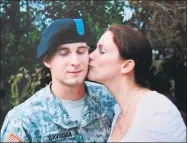  ?? Donna Chapman / Contribute­d photo ?? Donna Chapman gives her son, Sgt. William Davidson, a kiss. Davidson struggled with mental health disorders after his deployment in Afghanista­n and killed himself in 2017.