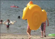  ??  ?? Youngsters find lots of fresh-water beach fun in Lake Ouachita State Park.