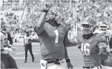  ?? AP PHOTO/JOSHUA L. JONES ?? Georgia backup quarterbac­k Justin Fields celebrates after a touchdown Saturday.