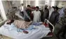  ?? - Reuters ?? INJURED: A man injured during kidnapping of two Chinese language teachers by unidentifi­ed gunmen lies on a hospital bed in Quetta, Pakistan on Wednesday.