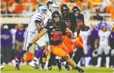  ?? BRIAN BAHR / GETTY IMAGES ?? Running back Chuba Hubbard, a Canadian, of the Oklahoma State
Cowboys had 296 yards against Kansas State.