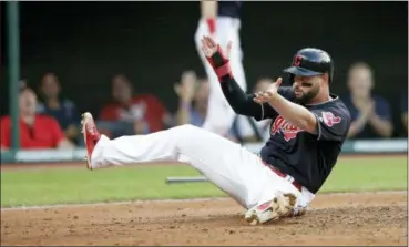  ?? TONY DEJAK — ASSOCIATED PRESS ?? Yonder Alonso celebrates after scoring in the third inning of the Indians’ victory over the Reds on July 11.