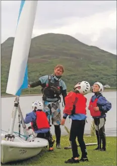  ??  ?? The boys learn about the tell-tales on the sail.B31sail09