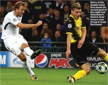  ??  ?? Harry at the double: Kane fires home his second goal of the night and Tottenham’s third in their victory over Group H rivals Dortmund