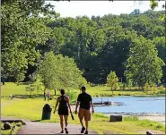  ?? MEDIANEWS GROUP FILE PHOTO ?? People walk along a path at Green Lane Park in Montgomery County.