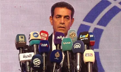  ?? Mahmud Turkia/AFP/Getty Images ?? Imed al-Sayeh, head of Libya's High National Election Commission (HNEC), gives a press conference in Tripoli on 24 October. Photograph: