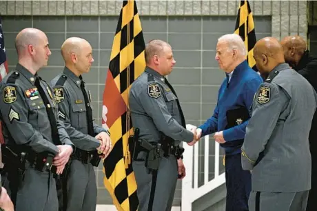  ?? JERRY JACKSON/STAFF ?? President Joe Biden thanks MDTA officers on Friday who stopped traffic to the Key Bridge before it collapsed.