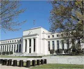  ?? /Reuters ?? Worrying: The Federal Reserve Building. While the Fed has brushed off any critique of its management of the monetary system, there is something menacing about the state of US banking.