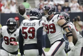  ?? DAVID J. PHILLIP - THE ASSOCIATED PRESS ?? Houston Texans defensive end J.J. Watt (99) celebrates after he recovered a ball fumbled by Jacksonvil­le Jaguars quarterbac­k Gardner Minshew during the second half of an NFL